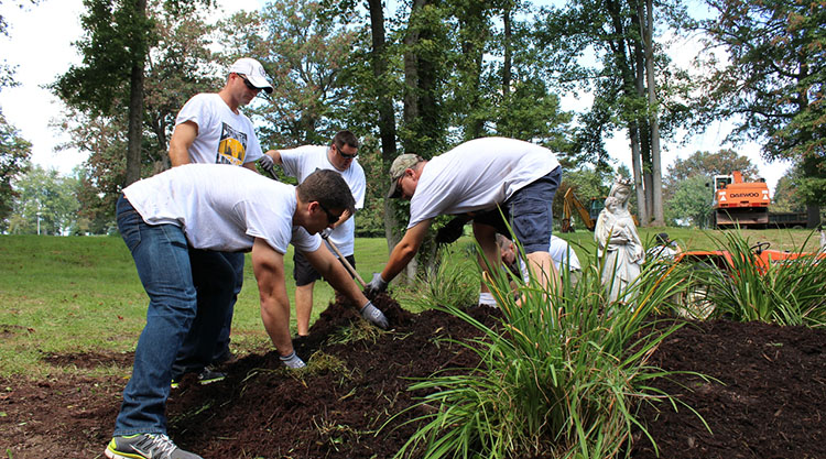 Landscapers from the Massaro Corp. beautify the grounds at the Mt. Macrina Manor nursing facility in Uniontown, Pa.